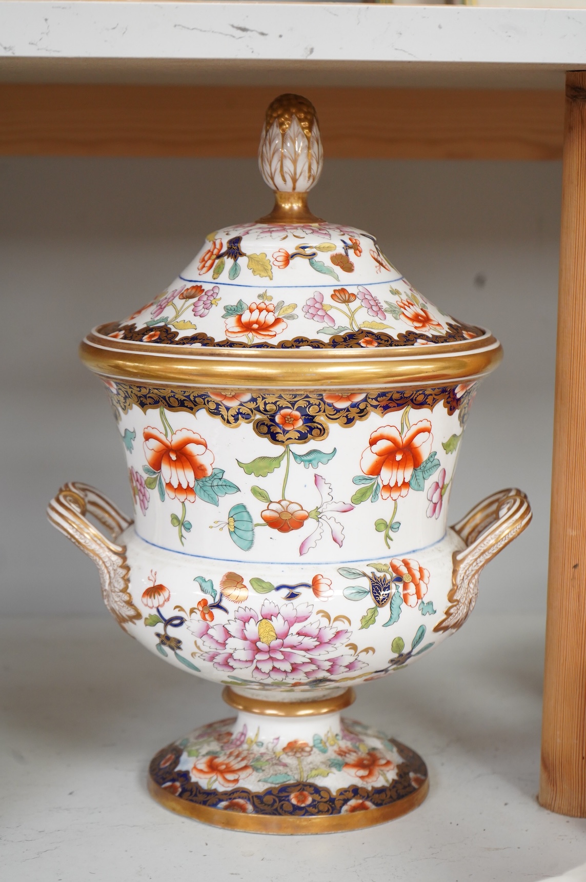An early 19th century English porcelain campana vase and matched cover, with twin handles, 33cm high